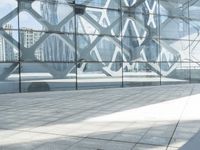 an image of a large building inside a glass structure of glass and a couple of people standing with luggage