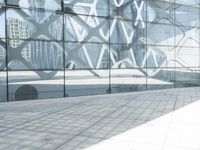 an image of a large building inside a glass structure of glass and a couple of people standing with luggage