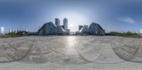 a big building sitting in the middle of a circle pattern made up of circles and squares