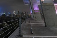 a view of the city at night from a balcony at a building site in new york