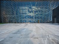 a large structure is shown through the glass windows of it's outside view area