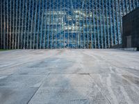 a large structure is shown through the glass windows of it's outside view area