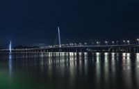 Shenzhen Night Skyline: Illuminated Bridges Over Calm Waters