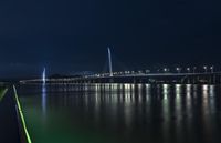 Shenzhen Night Skyline: Illuminated Bridges Over Calm Waters