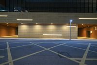 a parking garage with lights on in night time time for the city drivers to see