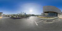 the view from a fish - eye lens lens of a skate park area and parking lot