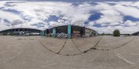 a 360 - angle view of an artistic photo of a skate park and an ocean