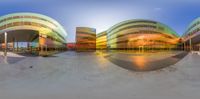 a 3d photo of people doing skateboarding tricks at a skate park at sunrise with sunraying on the building in back