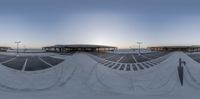 a photo taken of some skate park with a long line of tracks on it and sun behind them