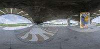 a panorama of skateboarders riding down the ramps at a skate park and some other skateboards