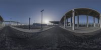 a set of panorama images show the view from a skateboard park in the middle of town