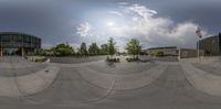 the view from a skateboard park looking up at a ramp and a building with an american flag