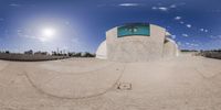 this fish eye view is captured with the lens set in place on a skateboard ramp