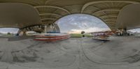 an image looking at a skateboard going in a circular shot on an outdoor ramp