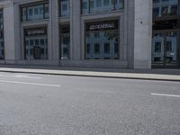 a man on a skateboard is riding down the street by a building with a green sign reading continental