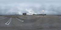 a skateboarder is in the air over a ramp, in a darkened city