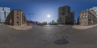 the skateboarder rides on his board in the city streets at night, looking up to the buildings