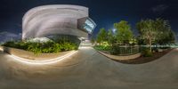 a skateboarder doing tricks on the concrete surface at night in the city park