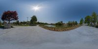 a fisheye lens shot of a skateboarder grinding a jump on his board