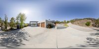 this is a skateboarder on the driveway in front of his home with a big door