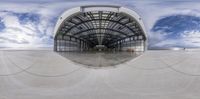 a photo of a skateboarder flying through a fish eye view frame on the ramp