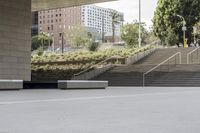 the skateboarder is going up the steps near the building where it stands the other direction