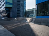 a skateboarder performing a trick in front of an office building with glass walls