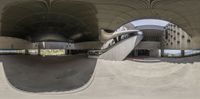 a skateboarder is doing stunts at an indoor skate park with stairs, ramp and ramp