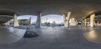 a reflection of a skateboarder doing tricks on the edge of a ramp with his camera