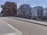 a skateboarder is in the middle of an empty road on a sunny day