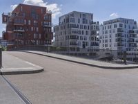 a skateboarder is in the middle of an empty road on a sunny day