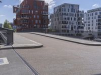 a skateboarder is in the middle of an empty road on a sunny day