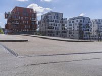 a skateboarder is in the middle of an empty road on a sunny day