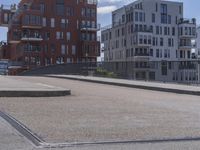 a skateboarder is in the middle of an empty road on a sunny day