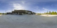 the skateboarder has taken a 360 - view of his skateboard in front of the building