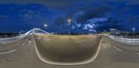 the camera is pointed at a skateboarder in mid air at night time in an empty park