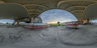 an image looking at a skateboard going in a circular shot on an outdoor ramp