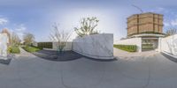 this 360 - shot shows a skateboarder practicing a trick on a ledge outside a building