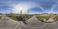 a 360 - view of a skate boarder at the top of a ramp next to rocks