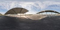 a skateboarder is riding on the road and has a camera attached to the top of the ramp