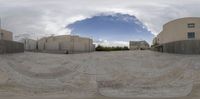 the lens is wide open and shows a skateboarder on a board on some concrete