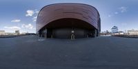 a skateboarder is going in a half - circle at the end of an empty street