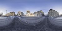 a skateboarder performs a trick on a half pipe in an empty court yard