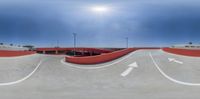 an aerial view of a skateboarder performing a trick on a ramp at a park