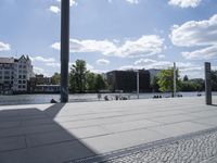 a person with a skateboard in a city setting and the sun is shining on it