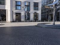 a skateboarder is riding in the middle of a city square of various buildings