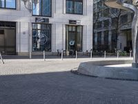 a skateboarder is riding in the middle of a city square of various buildings