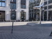 a skateboarder is riding in the middle of a city square of various buildings