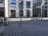 a skateboarder is riding in the middle of a city square of various buildings