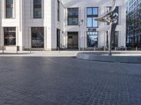 a skateboarder is riding in the middle of a city square of various buildings